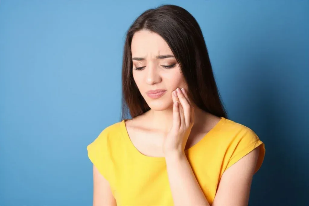 Patient experiencing tooth sensitivity after dental filling procedure