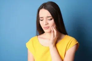 Patient experiencing tooth sensitivity after dental filling procedure