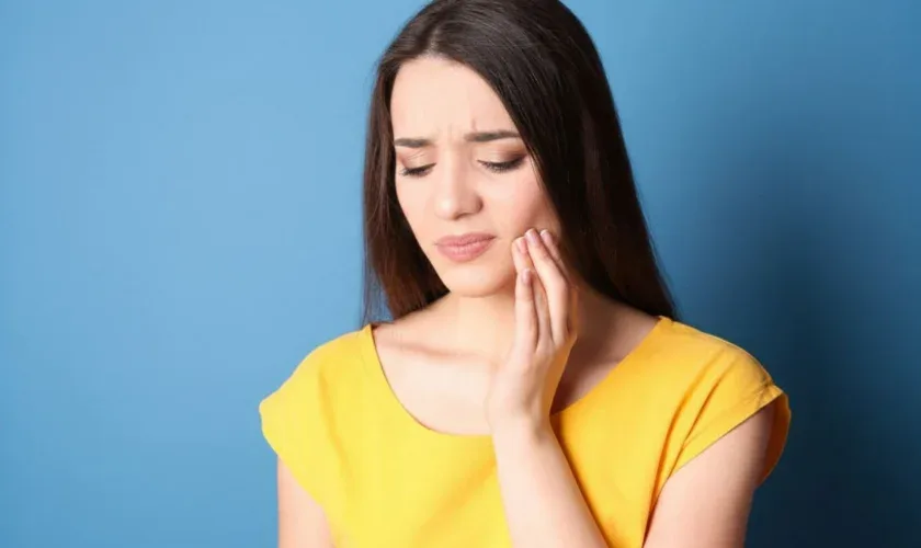 Patient experiencing tooth sensitivity after dental filling procedure