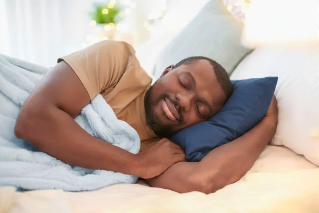 Man sleeping peacefully on his side in bed